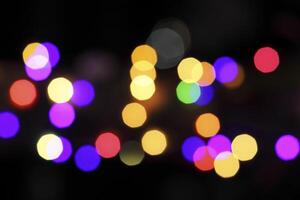 colorful and defocused lights on black background photo