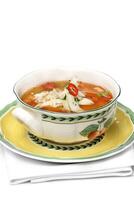 vegetable broth with cod fillets and pepper in a bowl photo