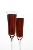 Kir Royale, sophisticated drink with cassis liqueur, champagne and red fruits photo