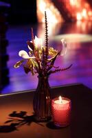 sophisticated party decoration with candles, flowers, tables and specialized lighting photo