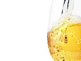 white wine being served in a glass on a white background photo