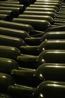 Barrels and bottles of wine in a winery cellar in southern Brazil photo