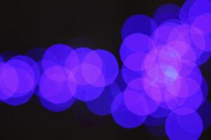 colorful and defocused lights on black background photo