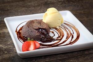 petit gateau with cream ice cream on plate photo