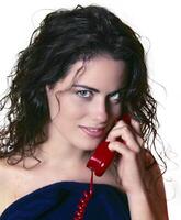 young model with wet hair talking on the phone photo