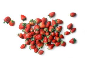 whole strawberries seen from above on white background photo