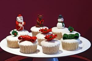 colorful cupcakes and truffles with Christmas motifs photo