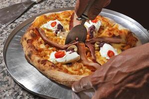 bacon pizza with cream cheese, cherry tomatoes and olives photo