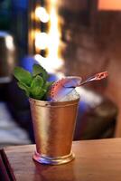 Mint Julep, drink with bourbon whiskey, sugar syrup and angustura photo