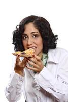 smiling brunette model with her piece of pizza photo