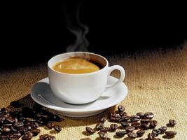 hot espresso coffee on jute background photo