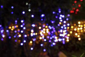 colorful and defocused lights on black background photo