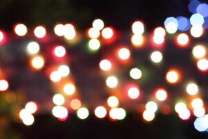 colorful and defocused lights on black background photo