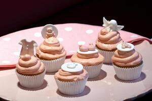 cupcakes with pink decoration and elements for girls' parties photo