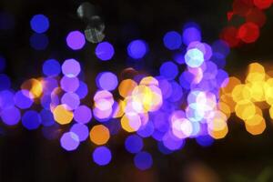 colorful and defocused lights on black background photo