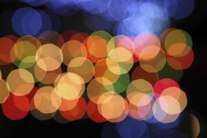 colorful and defocused lights on black background photo