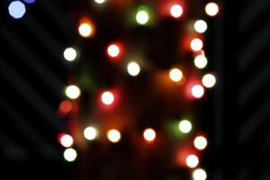 colorful and defocused lights on black background photo