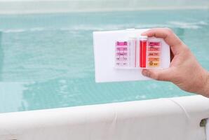 PH and chlorine analysis kit for swimming pools. Liquid chlorine and PH meter for swimming pools. photo