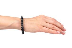 Beautiful natural bracelet made of natural stone on a woman's hand isolated on a white background. Close-up. photo