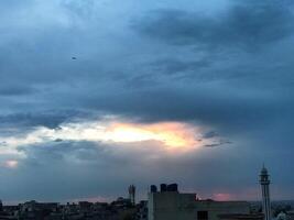 a view of the sunset from the roof of a building photo