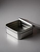 Rectangular tin box with an open lid. Metal box for various purposes. Gray back photo