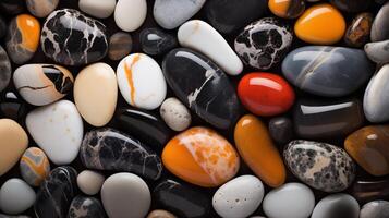 Multi-colored pebbles. Colored round pebbles lying tightly next to each other. Dark back photo