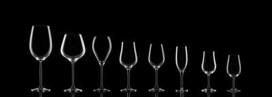 empty wine glasses on black background photo