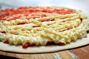 pizza being prepared with Catupiry, famous Brazilian creamy cheese photo