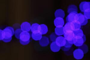 colorful and defocused lights on black background photo