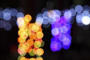 colorful and defocused lights on black background photo