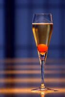 Champagne cocktail, light drink with a cube of sugar, cognac, angostura and brut champagne photo