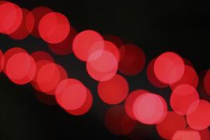 colorful and defocused lights on black background photo