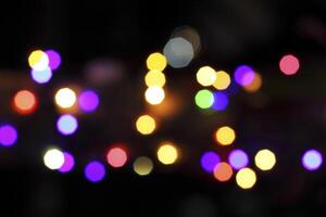 colorful and defocused lights on black background photo