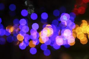 colorful and defocused lights on black background photo