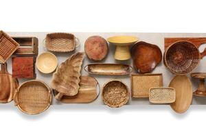 assembly with wooden plates, platters, pans and bowls seen from above photo