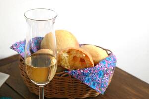 wooden table with snacks, fruits and cheeses to be tasted with pinga, the famous Brazilian brandy photo