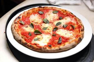 step-by-step guide on how to eat authentic Neapolitan pizza with your hands photo