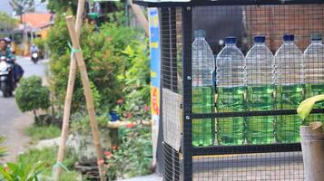 Display of retail gasoline sales packaged in 1 liter bottles, photo