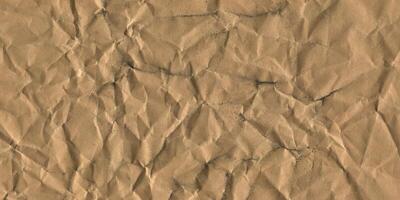 Crumpled Brown Paper Textured Background. Grunge Texture with Creases and Wrinkles photo