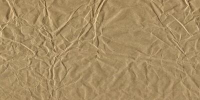 Crumpled Brown Paper Textured Background. Grunge Texture with Creases and Wrinkles photo