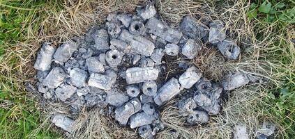 The ashes of the dead on the grass in the form of a heart photo