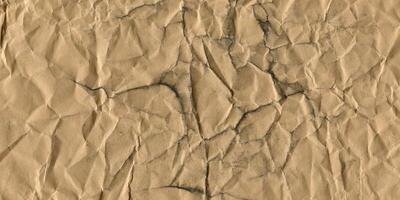 High-resolution Background Crumpled Brown Paper Texture with Creases and Wrinkles photo