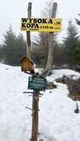 Top of the mountain, memorial sign on the peak in the Polish Mountains. Wysoka Kopa photo