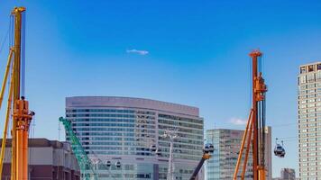 A timelapse of crane at the under construction in Yokohama panning video