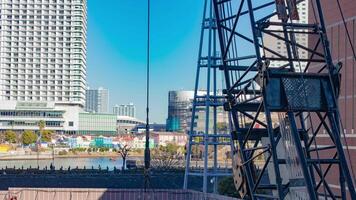 A timelapse of crane at the under construction in Yokohama telephoto shot zoom video