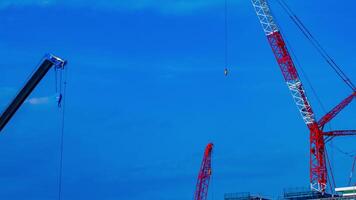 A timelapse of cranes at the under construction in Tokyo video