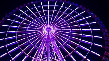 A timelapse of ferris wheel at the amusement park in Tokyo at night video