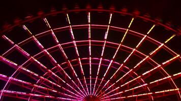 A timelapse of ferris wheel at the amusement park in Tokyo at night video