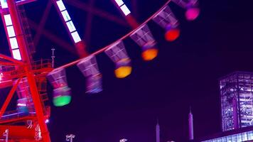 A timelapse of ferris wheel at the amusement park in Tokyo at night video