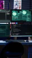 Vertical Script running on computer in secret base of operations used by hacker to steal data. Programming language on screen in empty room used by cybercriminal, attacking firewalls video